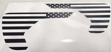 A close up of the american flag on a car