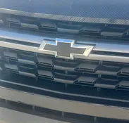 A close up of the front grill on a car